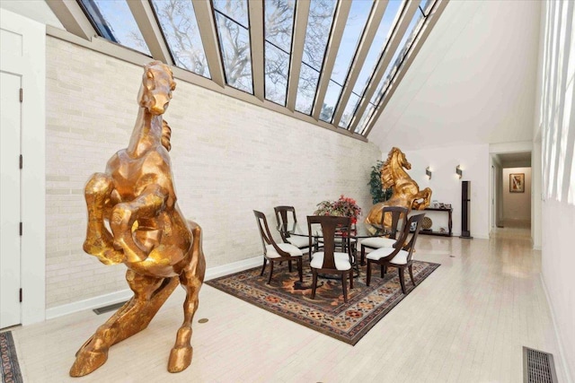 dining room with a towering ceiling