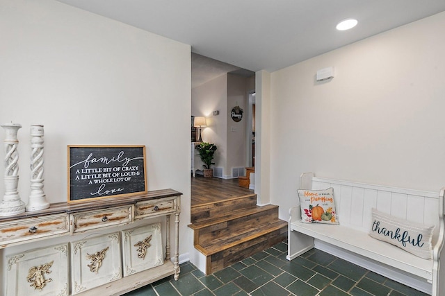 hallway featuring dark tile patterned flooring