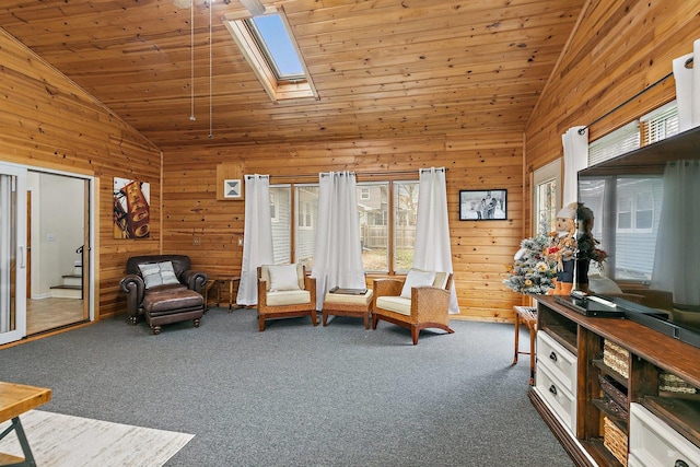 living area featuring a skylight, wooden walls, wooden ceiling, and dark carpet