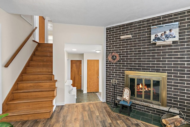 interior space with hardwood / wood-style floors and a fireplace