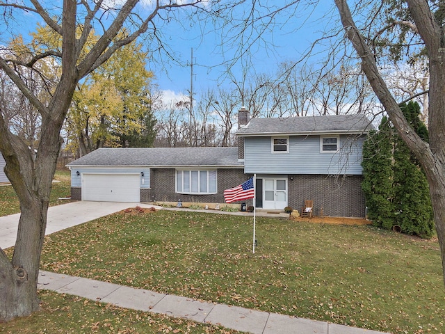 view of front of home with a front lawn and a garage