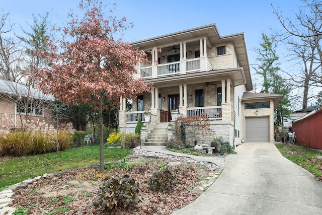 view of front of property with a garage, a balcony, and covered porch