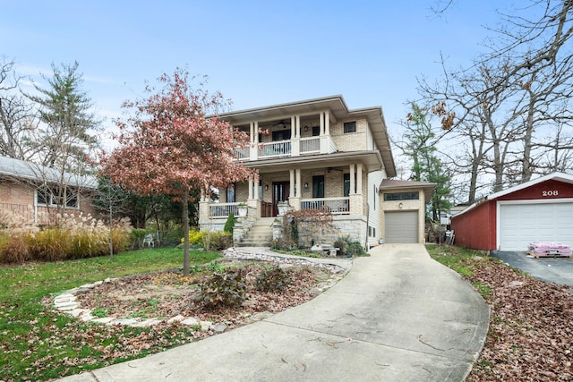 view of front of house with a balcony, a garage, an outdoor structure, and covered porch