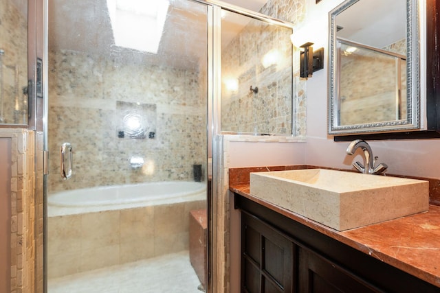 bathroom featuring vanity and plus walk in shower