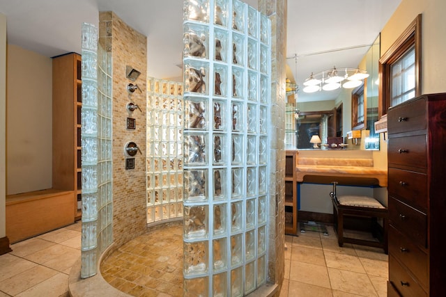 bathroom featuring tile patterned flooring and walk in shower