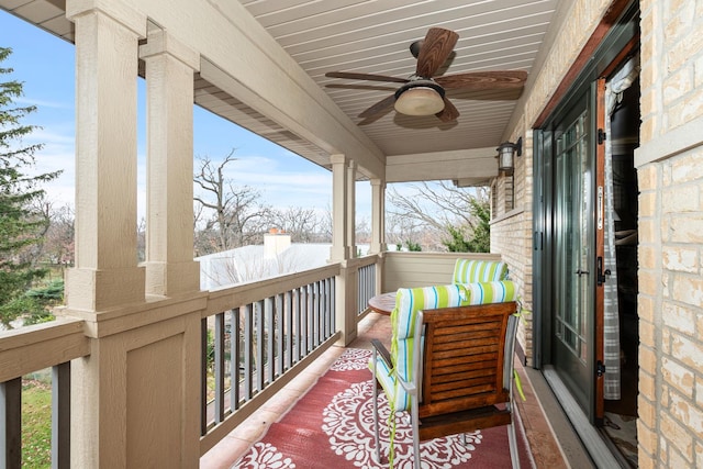 balcony featuring ceiling fan and covered porch