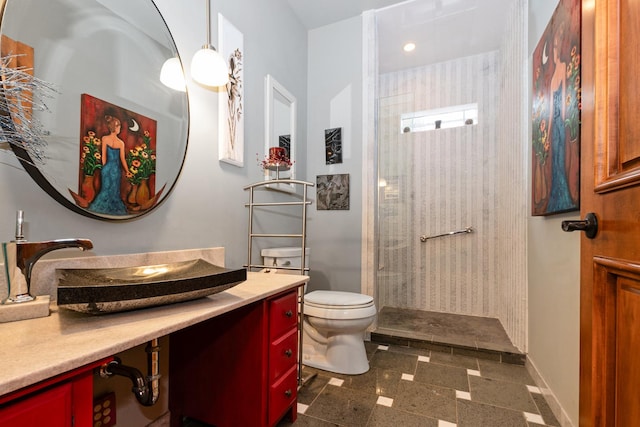 bathroom featuring a shower, vanity, and toilet