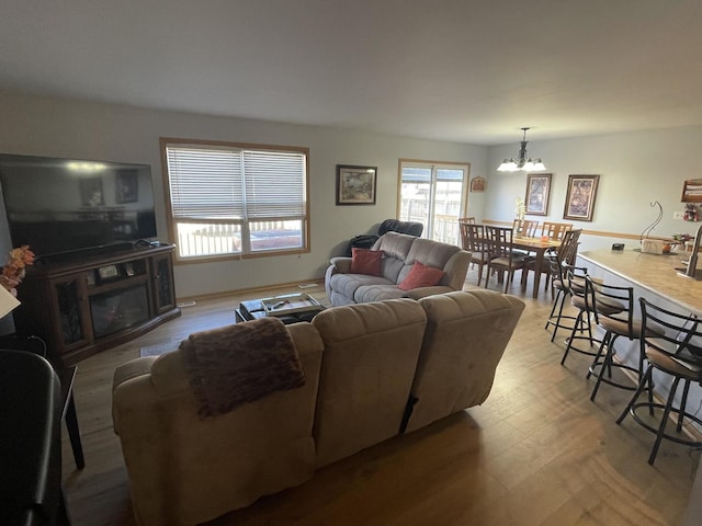 living room featuring hardwood / wood-style floors and a chandelier