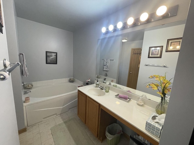 bathroom with vanity and a washtub