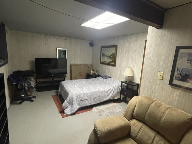 carpeted bedroom featuring beamed ceiling and wooden walls