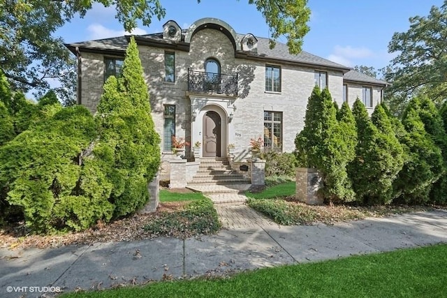 view of front of house with a balcony