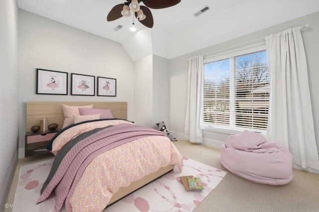 bedroom featuring light carpet, vaulted ceiling, and ceiling fan