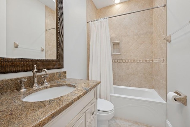 full bathroom with vanity, toilet, and shower / tub combo