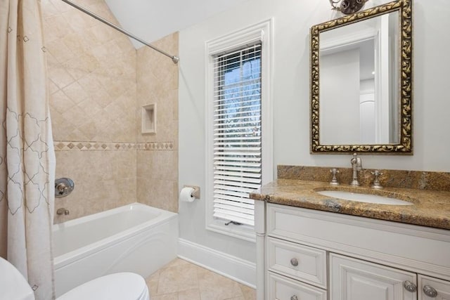 full bathroom with tile patterned flooring, vanity, toilet, and shower / bath combo with shower curtain