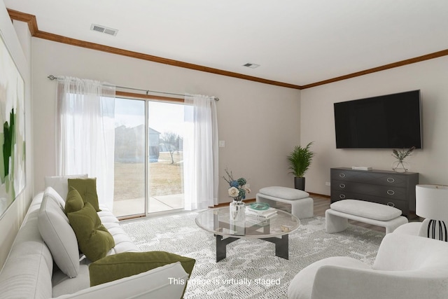 living room featuring hardwood / wood-style flooring and ornamental molding