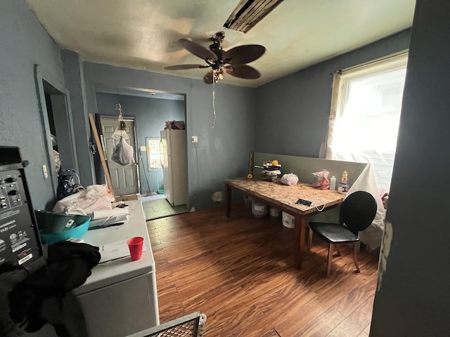 office space with ceiling fan and light hardwood / wood-style flooring