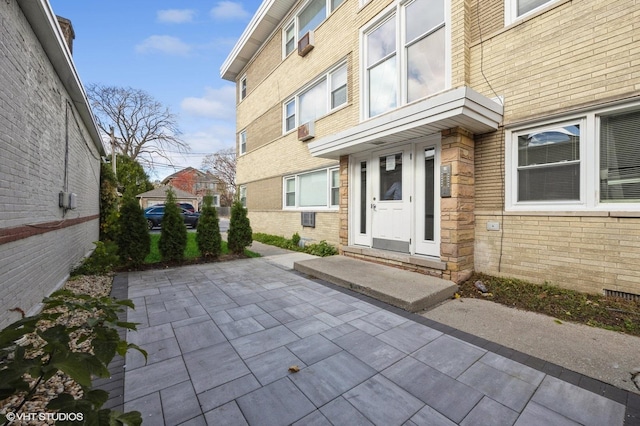 doorway to property featuring a patio area