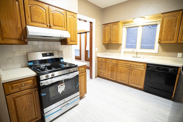 kitchen with black dishwasher, decorative backsplash, stainless steel range with gas cooktop, and sink