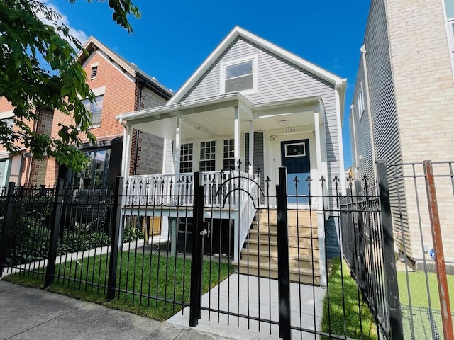 bungalow-style house featuring a porch and a front lawn