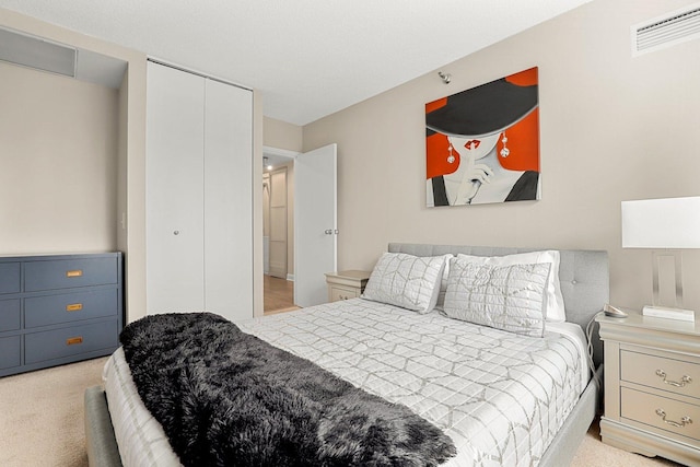 carpeted bedroom featuring a closet