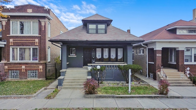 bungalow-style house featuring covered porch