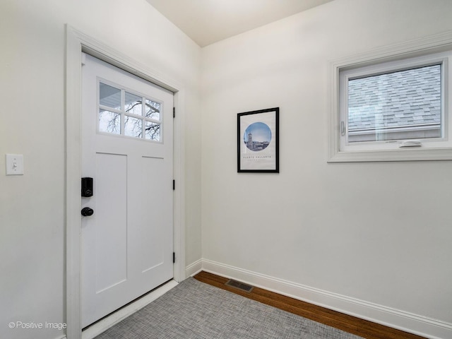 foyer entrance featuring hardwood / wood-style floors