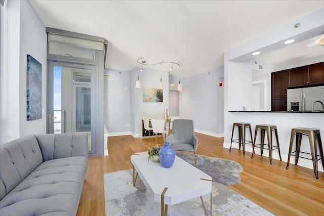 living room featuring light wood-type flooring