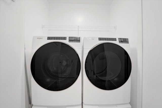 washroom with washer and clothes dryer