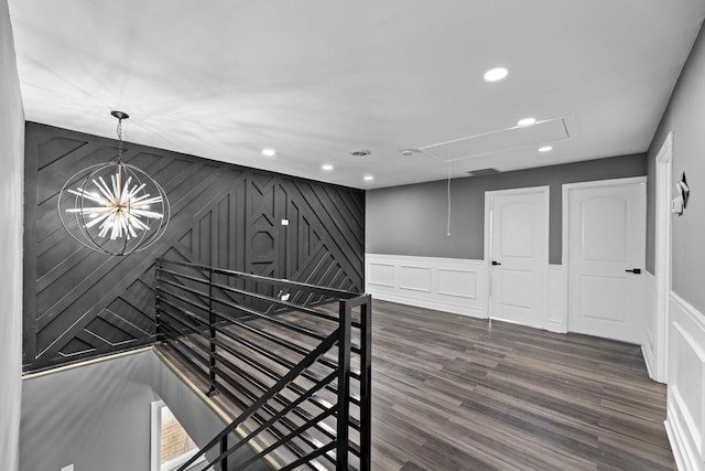 interior space with a chandelier and dark wood-type flooring