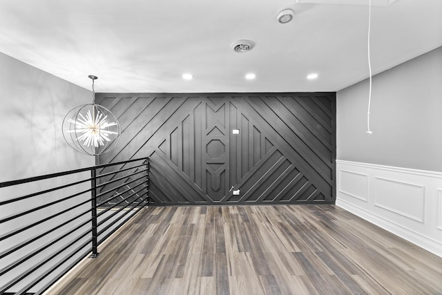 interior space featuring a chandelier and hardwood / wood-style flooring