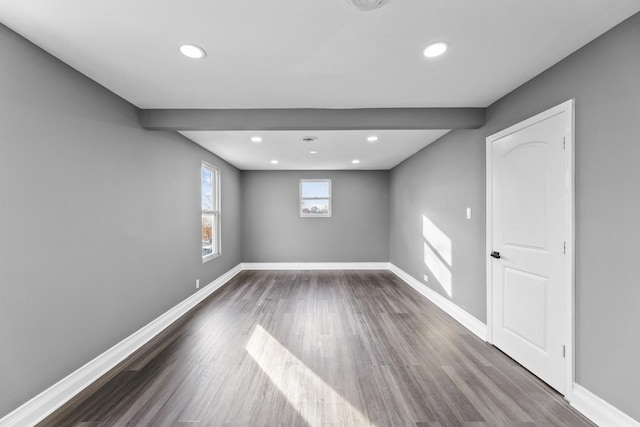 basement featuring dark hardwood / wood-style flooring