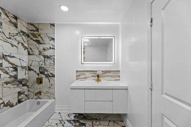 bathroom with vanity, backsplash, and bathing tub / shower combination