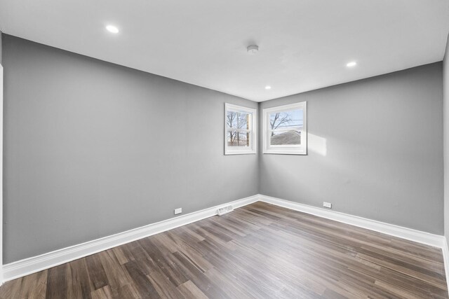 spare room featuring hardwood / wood-style flooring