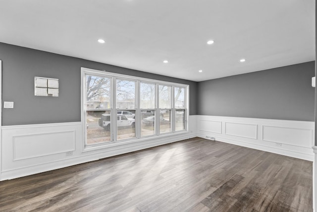 empty room with dark wood-type flooring