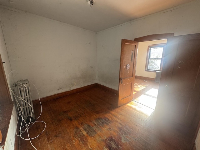 empty room featuring hardwood / wood-style flooring