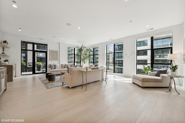 living room with light hardwood / wood-style floors