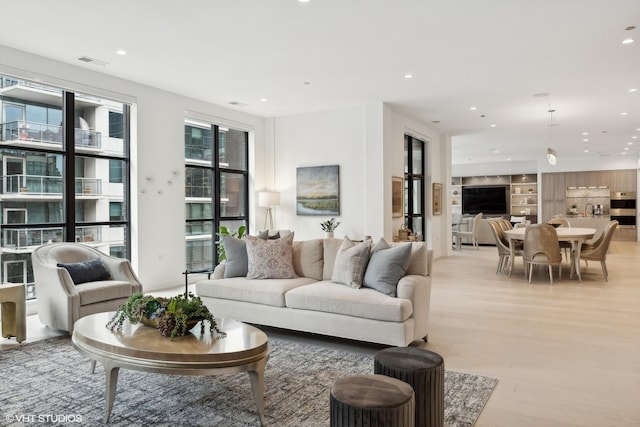 living room with light hardwood / wood-style floors