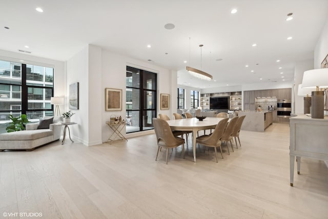 dining room featuring light hardwood / wood-style flooring