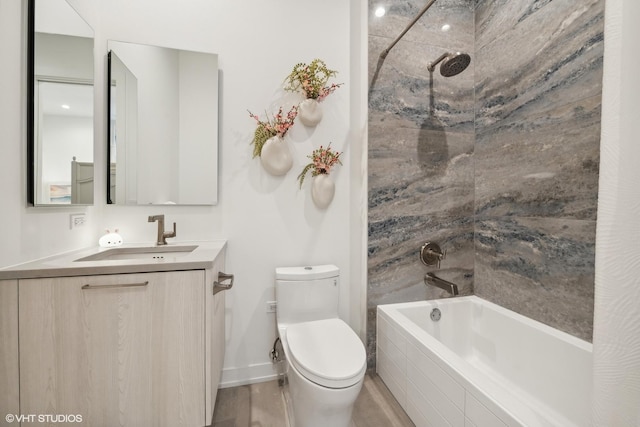 full bathroom featuring wood-type flooring, vanity, toilet, and tiled shower / bath