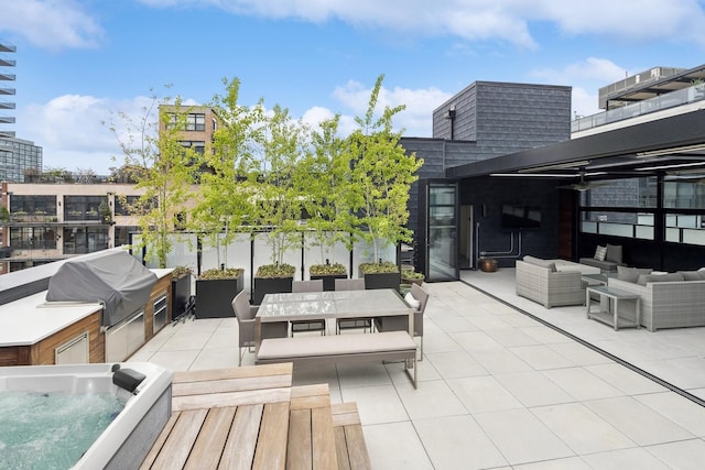 view of patio featuring grilling area, an outdoor living space, and an outdoor kitchen