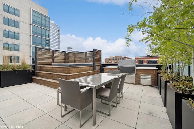 view of patio with area for grilling and grilling area