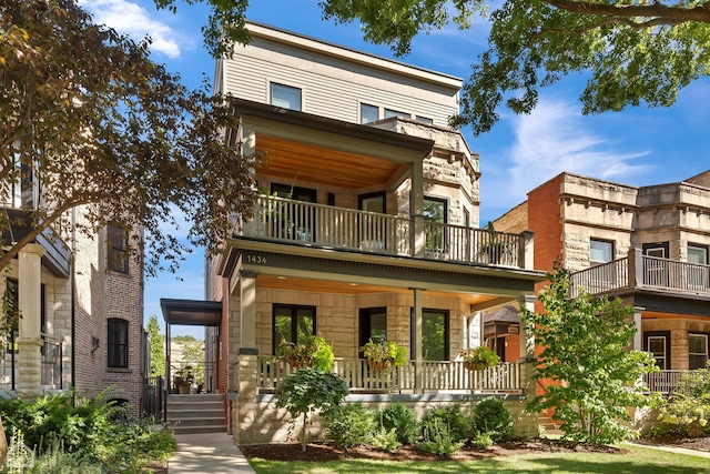 contemporary home with a porch and a balcony