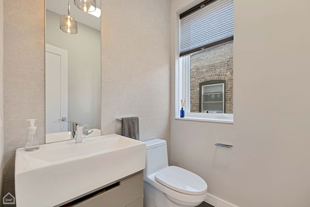 bathroom with vanity and toilet