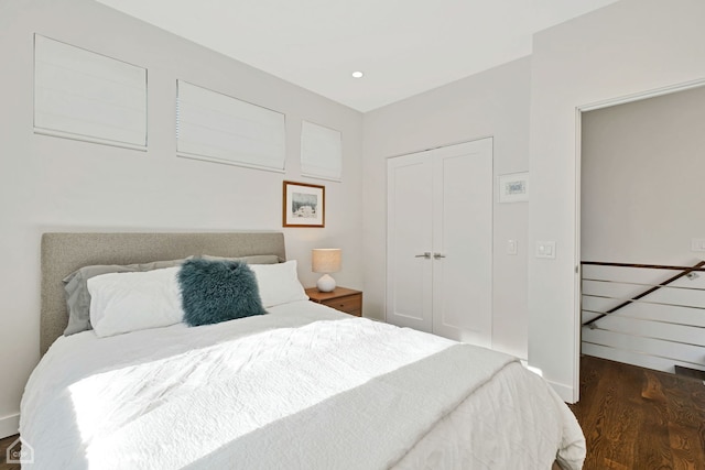 bedroom featuring a closet and dark wood-type flooring