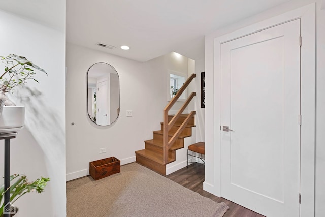 foyer entrance with dark hardwood / wood-style flooring