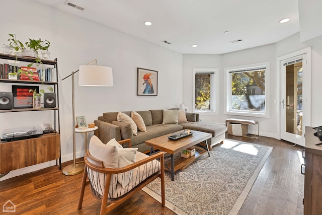 living room with dark hardwood / wood-style floors