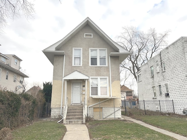 view of front of property with a front lawn