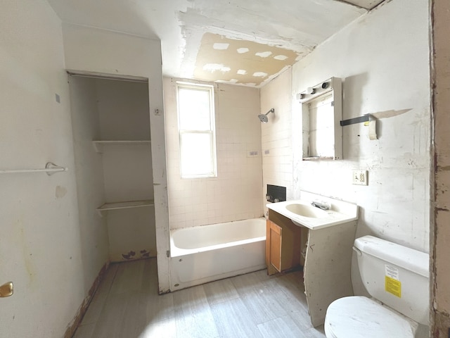 full bathroom with vanity, toilet, and tiled shower / bath combo