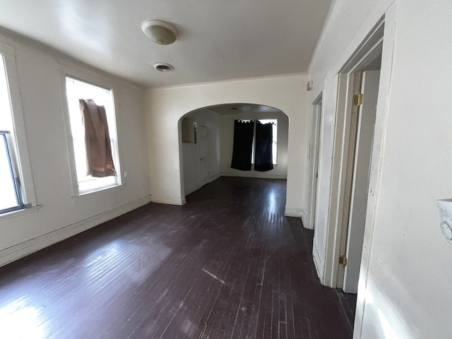 spare room with dark hardwood / wood-style flooring