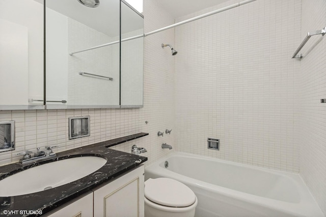 bedroom with connected bathroom and dark parquet floors